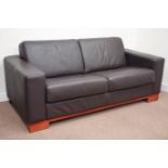 Large three seat sofa upholstered in brown leather, fitted with foldout bed,