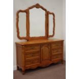 Light oak French style sideboard fitted with six drawers and centre cupboard with triple mirror