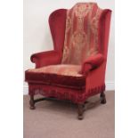 Late 20th century upholstered wingback armchair raised on oak finish base Condition