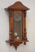 Victorian walnut Vienna clock, projected moulded cornice over glazed door,