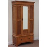 Early 20th century oak single wardrobe enclosed by mirror glazed door, with single drawer to base,