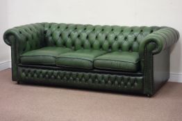 Three seat Chesterfield sofa upholstered in buttoned bottle green leather,
