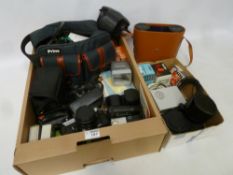 Fujica STX-1 SLR camera, two pairs of binoculars,