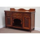 Edwardian walnut buffet side board fitted with four drawers and two cupboards,