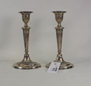 Pair of Edwardian loaded silver candlesticks by Fordham & Faulkner (William Charles Fordham &