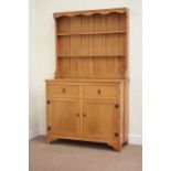 Light oak dresser fitted with two cupboard and two drawers, two heights plate rack above, W110cm,