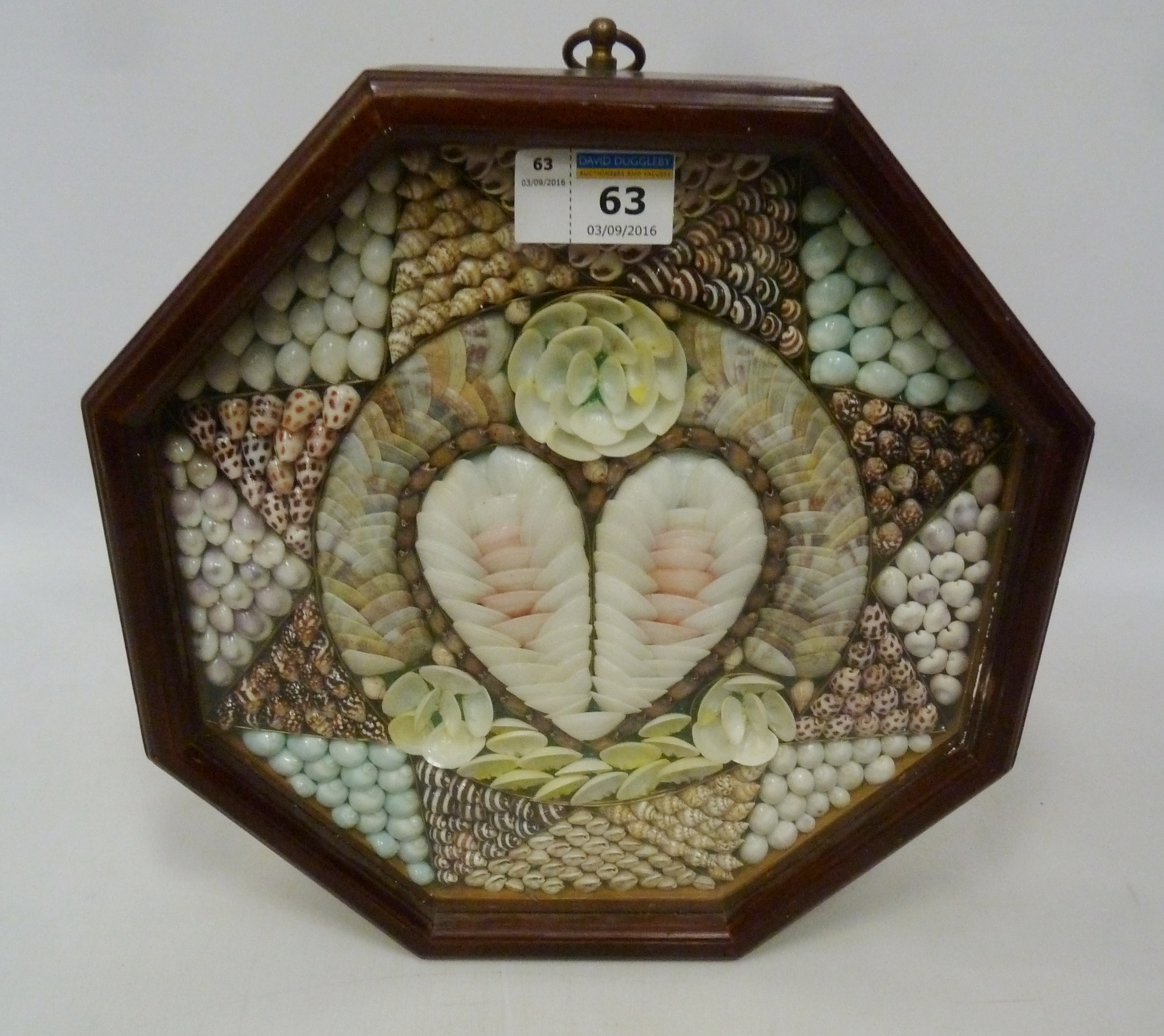 'Sailers' Valentine shell picture in octagonal mahogany case Condition Report
