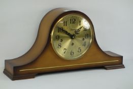 Mahogany finished mantel clock, of arched form Brush metal dial, Arabic numeral,