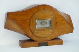 Cut down propeller clock, with rectangular face, 'Heany, Southern Rhodesia 1943', W 45cm H 27cm,
