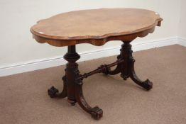 Late Victorian centre table, shaped figured walnut top, raised on carved rosewood base,