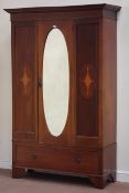 Edwardian wardrobe enclosed by single door with oval bevel edged mirror, single drawer to base,