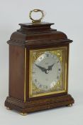 Mahogany cased clockwork mantle clock , John Walker London, Elliott, mounted by handle,