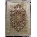 Kashan style carpet, central rosette over red ground, all over floral design and boarders,