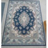 Persian design carpet, central floral medallion, over blue ground, spandrels, floral boarders,