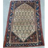 Persian rug all over geometric design over cream ground, spandrels, triple boarders,