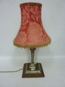 Lamp mounted by urn finial,