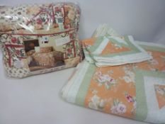 A king size patchwork quilt 'Autumn Gold' in original packaging and another floral king size