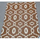 Rajasthani carpet with lozenge design, over brown ground,