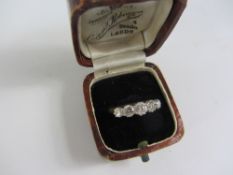 Brilliant cut graduating five stone Diamond platinum set ring, the centre stone of approx 0.