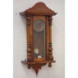 Victorian walnut Vienna clock, projected moulded cornice over glazed door,