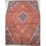 Meimeh carpet, central diamond over red ground, all over floral design, spandrels, double boarder,