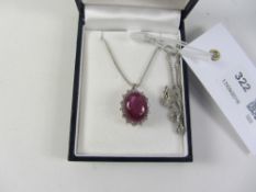 Cabochon ruby and diamond cluster pendant necklace hallmarked 18ct - ruby approx 10.