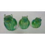 Three graduated Glasform iridescent frogs with original labels and one etched 'J.