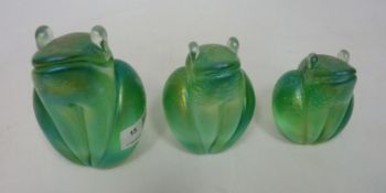 Three graduated Glasform iridescent frogs with original labels and one etched 'J.