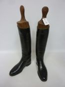 A pair of black leather riding boots by A Ellingworth,