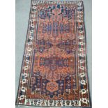 Persian Baktihari long carpet, with two cruciform medallions,