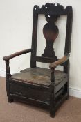 Early 18th century country oak lambing armchair, vase shaped splat back,
