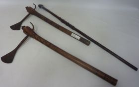 Two African axes with carved hardwood handles and a 19th/ early 20th Century tribal possibly Zulu
