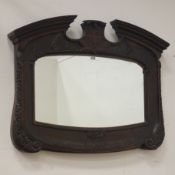 Early 20th century carved oak mirror, swan neck pediment with dentil detail,