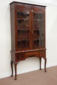 Victorian mahogany glazed bookcase enclosing adjustable shelves on later stand with three frieze