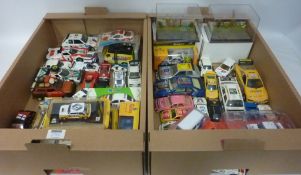 Two model vehicle Dioramas and a collection of various Diecast model rally cars in two boxes