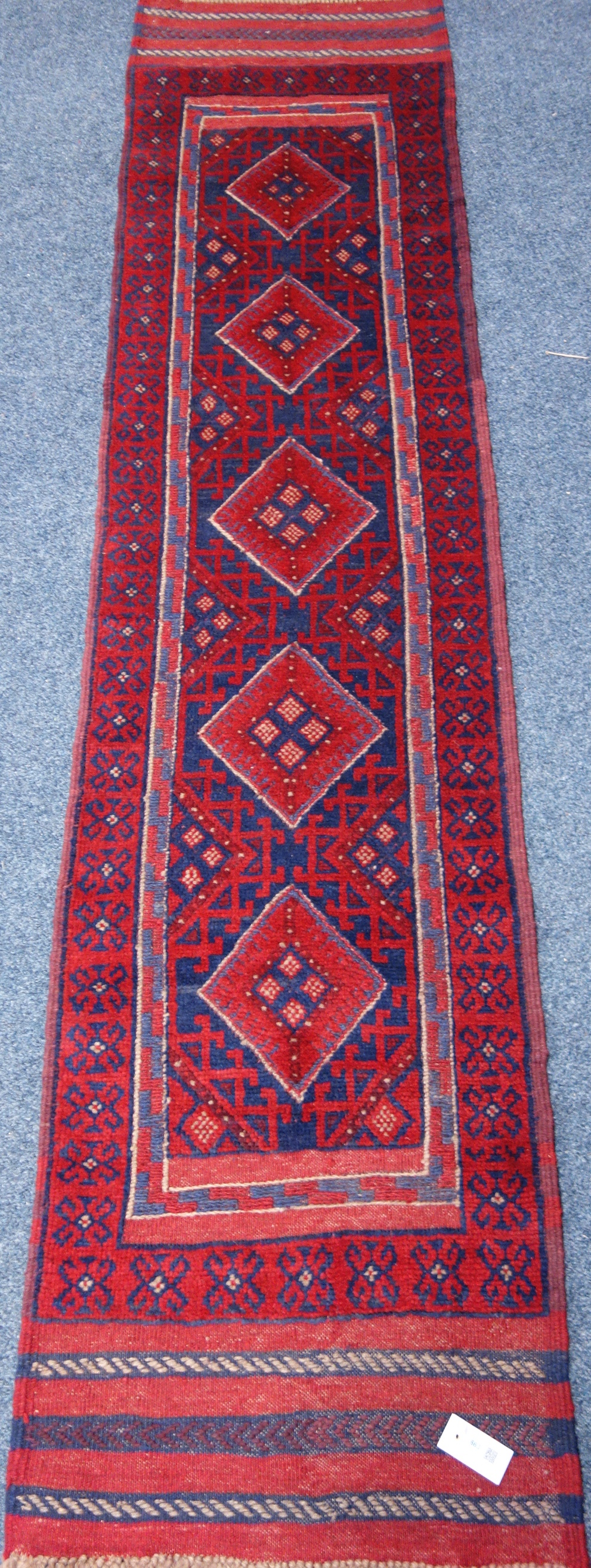 Meshwani red and blue ground runner rug,