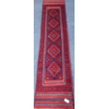 Meshwani red and blue ground runner rug,