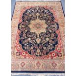 Persian Tabriz blue ground rug, large central medallion with floral field, signed by the weaver,