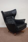 G-Plan 1960s wing back swivel chair upholstered in black cover Condition Report
