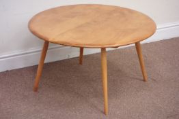 Ercol light elm burr circular coffee table raised on tapering legs, D74cm,