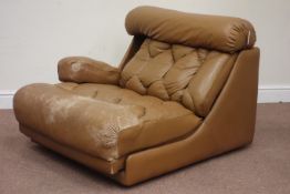 1970s Danish De Sede type modular armchair upholstered in tan leather, double retractable arm rests,