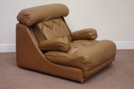 1970s Danish De Sede type modular armchair upholstered in tan leather, double retractable arm rests,