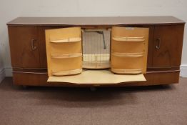 Mid 20th century 'Beautility' walnut serpentine sideboard fitted with two cupboards and centre