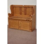 Waxed pine pew/settle, fitted with hinged lid enclosing storage space,