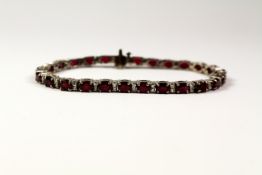 Oval ruby and diamond bracelet stamped 14k (ruby approx 11 carats) Condition Report