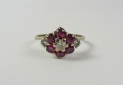 Ruby and diamond white gold cluster ring stamped 18ct Condition Report <a