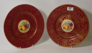 Pair of Royal Worcester plates with hand-painted panels of fruit by J.