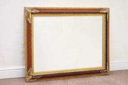 Large wall hanging mirror, moulded rectangular frame gilt shell corners and slip,