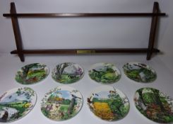 Set of eight Wedgewood 'Newmans Country Panarama', collectors plates with rack,