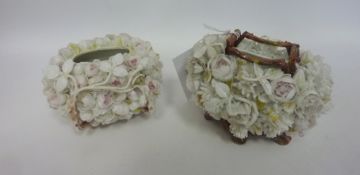 Two 19th Century porcelain baskets encrusted with flowers and foliage.